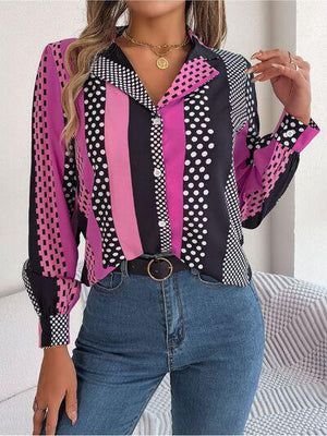 a woman wearing a pink and black shirt