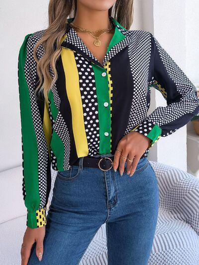 a woman wearing a colorful shirt and jeans