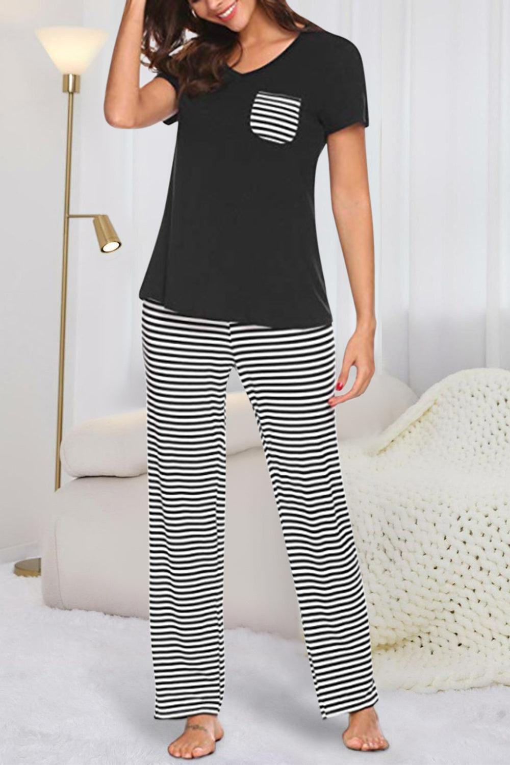 a woman wearing a black and white striped pajama set