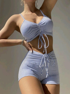 a woman in a blue and white striped bathing suit