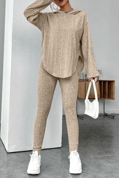 a woman in a beige sweater and pants