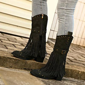a pair of black boots with fringes on them