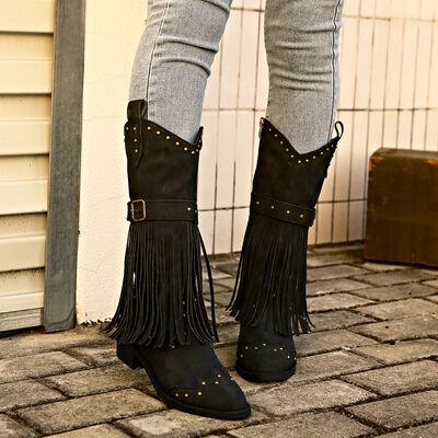 a pair of black boots with fringes on them