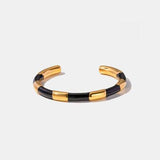 a black and gold cuff bracelet