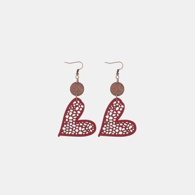 a pair of earrings with a heart on it