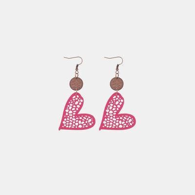 a pair of earrings with a heart on it