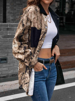 a woman in jeans and a white top is walking down the street