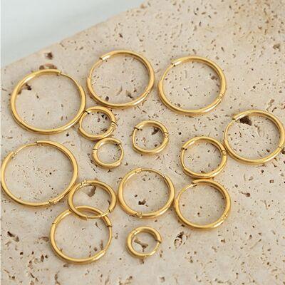 a bunch of gold rings sitting on top of a table