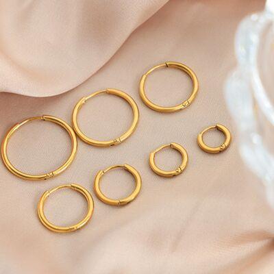 a set of five pairs of gold hoop earrings