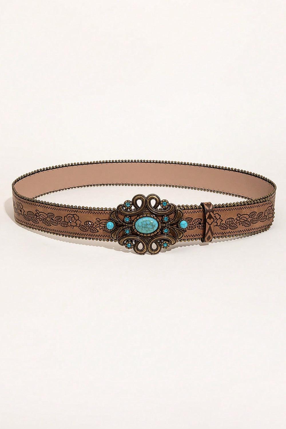 a belt with a turquoise stone in the center