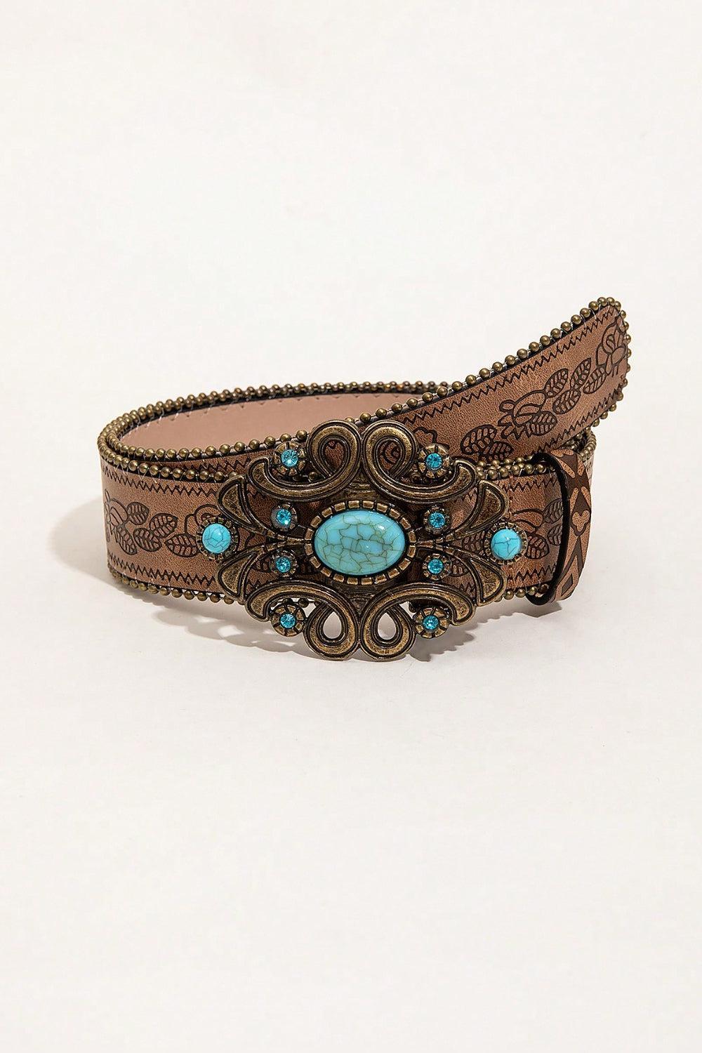 a belt with a turquoise stone in the center
