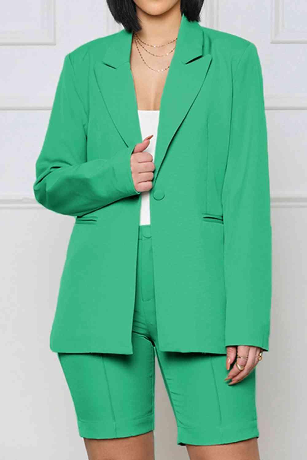 a woman wearing a green suit and shorts