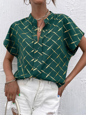 a woman wearing a green shirt and white shorts