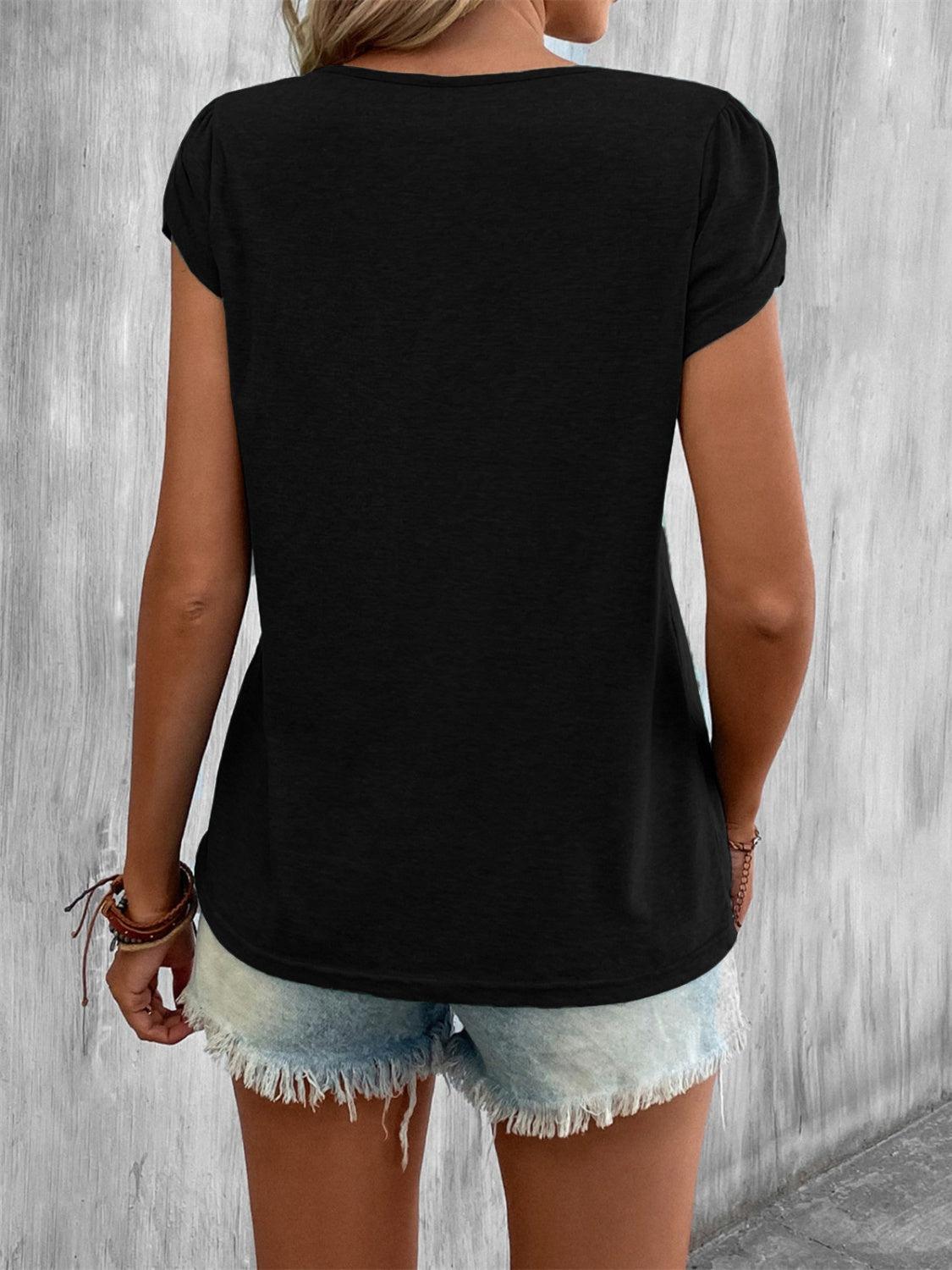 the back of a woman wearing a black shirt