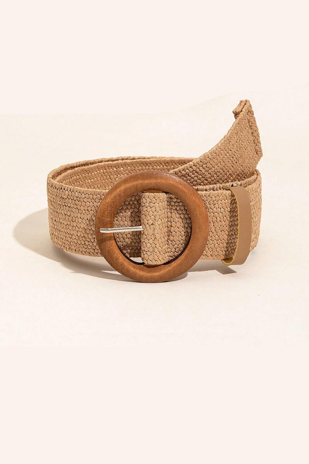 a belt with a wooden buckle on a white background