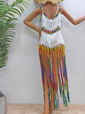 a mannequin wearing a colorful dress and a straw hat