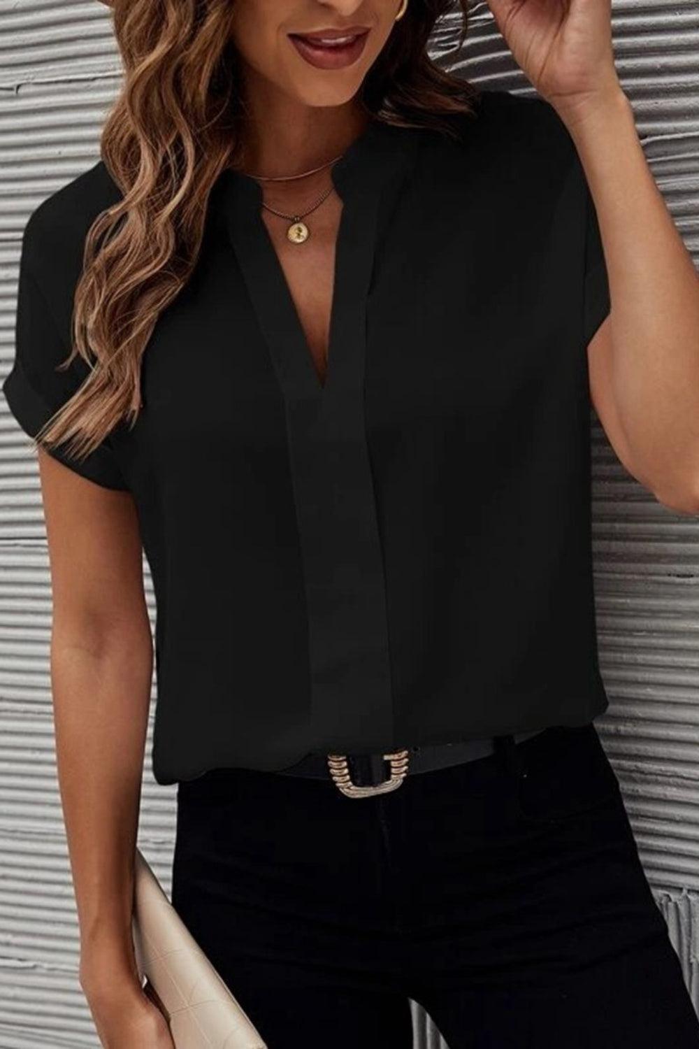 a woman wearing a black shirt and black pants