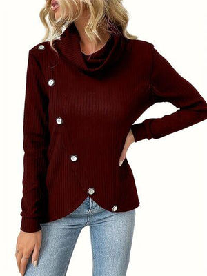 a woman wearing a red sweater and jeans