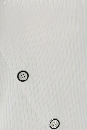 a close up of a white wall with buttons on it
