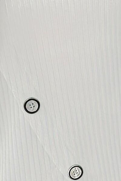 a close up of a white wall with buttons on it