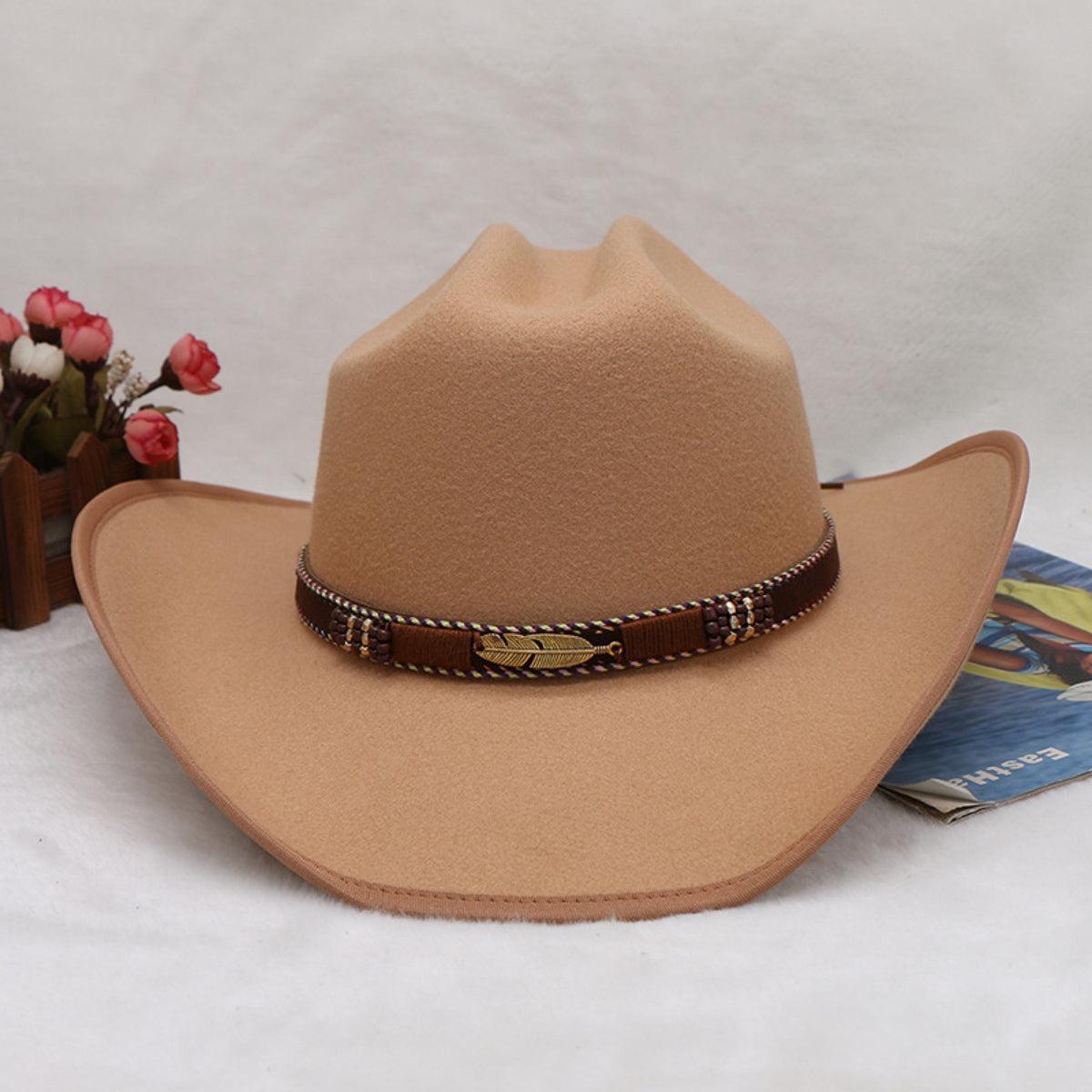 a brown cowboy hat with a brown belt around it