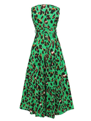 a green and black dress with a leopard print