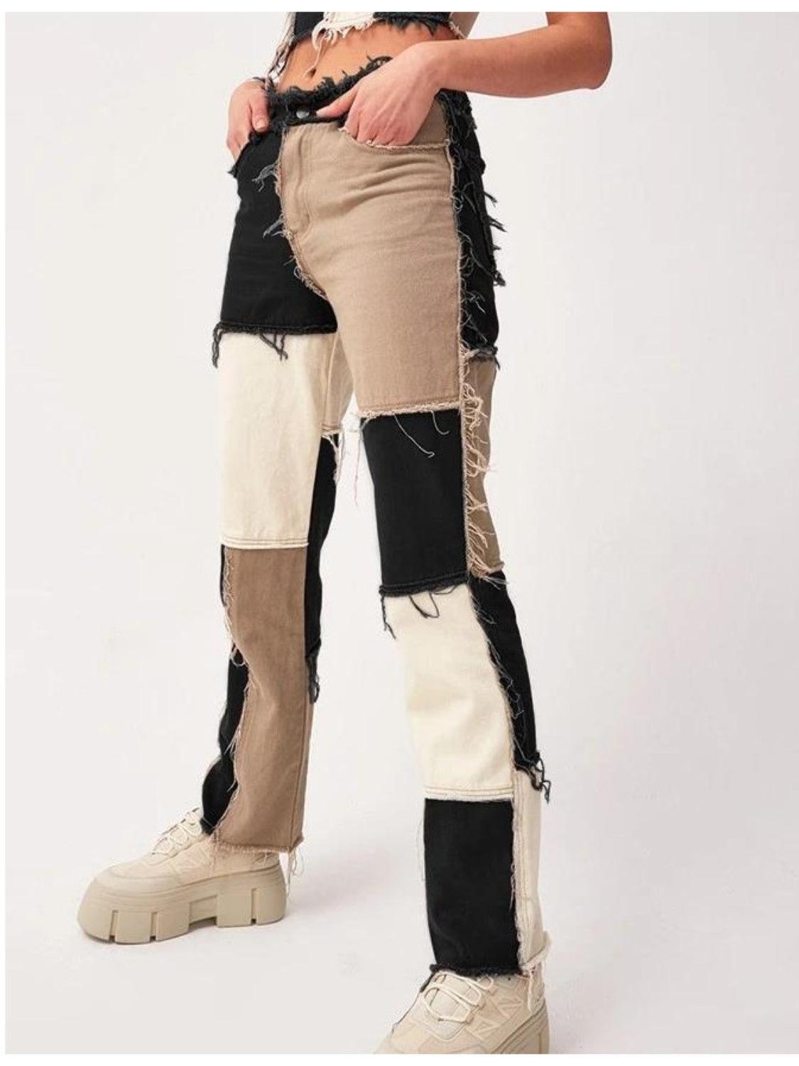 a person wearing a pair of pants with patches on them