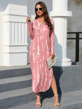 a woman wearing a pink and white dress