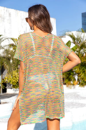 a woman standing next to a pool wearing a colorful dress