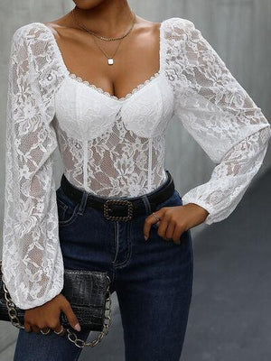 a woman wearing a white blouse and jeans