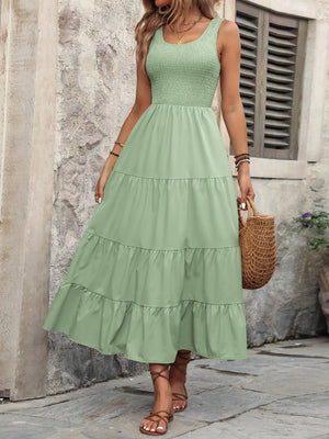 a woman in a green dress is walking down the street