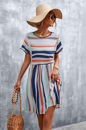 a woman in a striped dress and straw hat