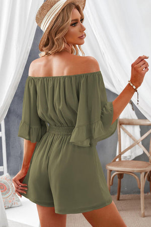 a woman wearing a green off the shoulder rom