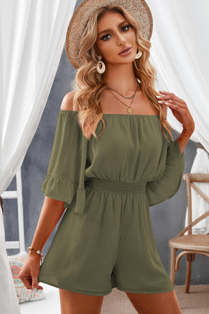 a woman wearing a green off the shoulder rom