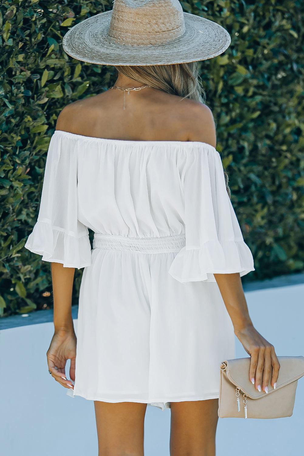 a woman wearing a white off the shoulder dress and a straw hat