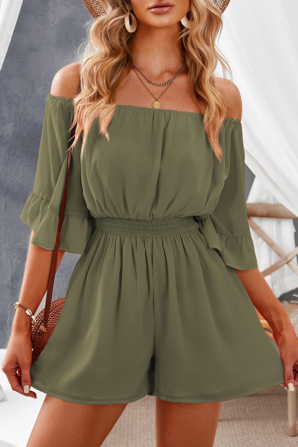 a woman wearing a green off the shoulder rom