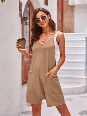 a woman in a tan dress holding a cup of coffee