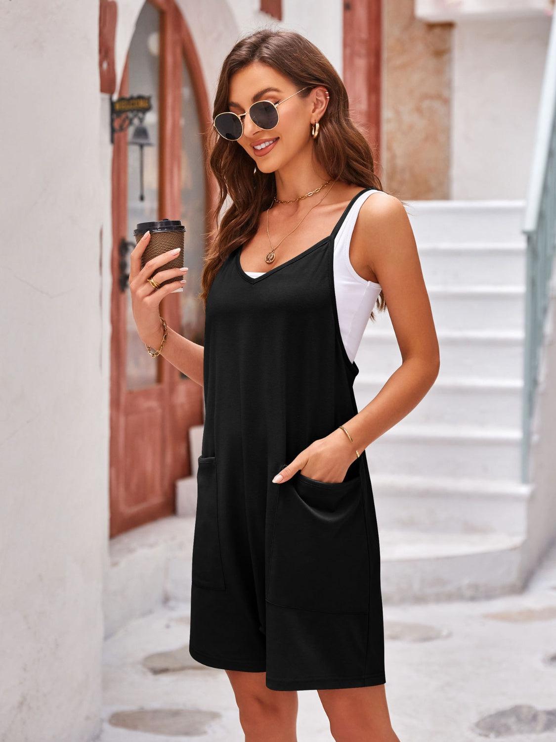 a woman in a black and white dress holding a cell phone