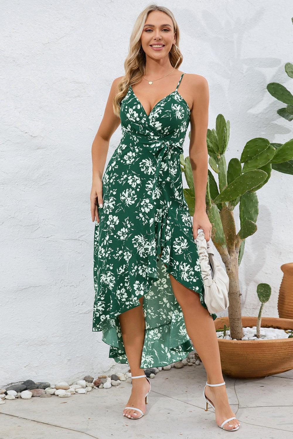 a woman wearing a green floral print dress