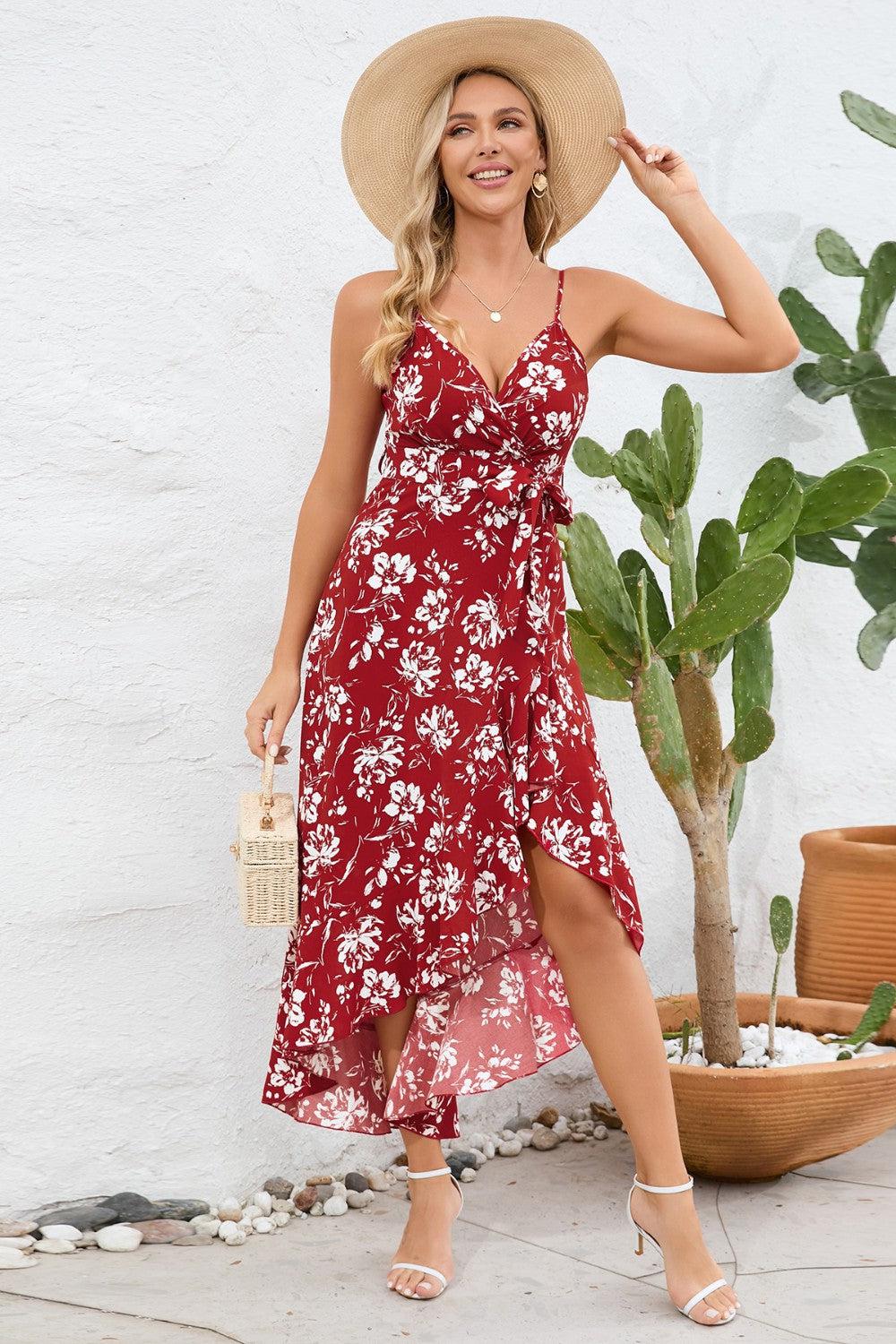 a woman wearing a red floral dress and hat