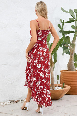 a woman wearing a red floral print dress