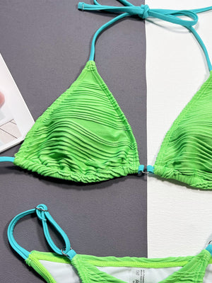 a woman's bikini top with a tie around the bottom