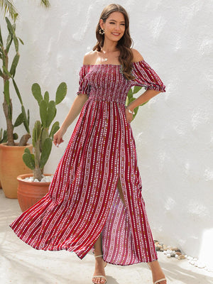 a woman wearing a red and white striped dress