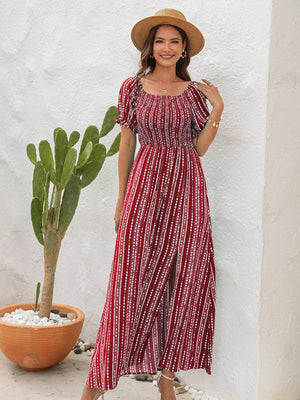 a woman wearing a red and white striped dress