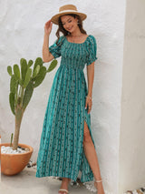 a woman standing next to a cactus wearing a hat