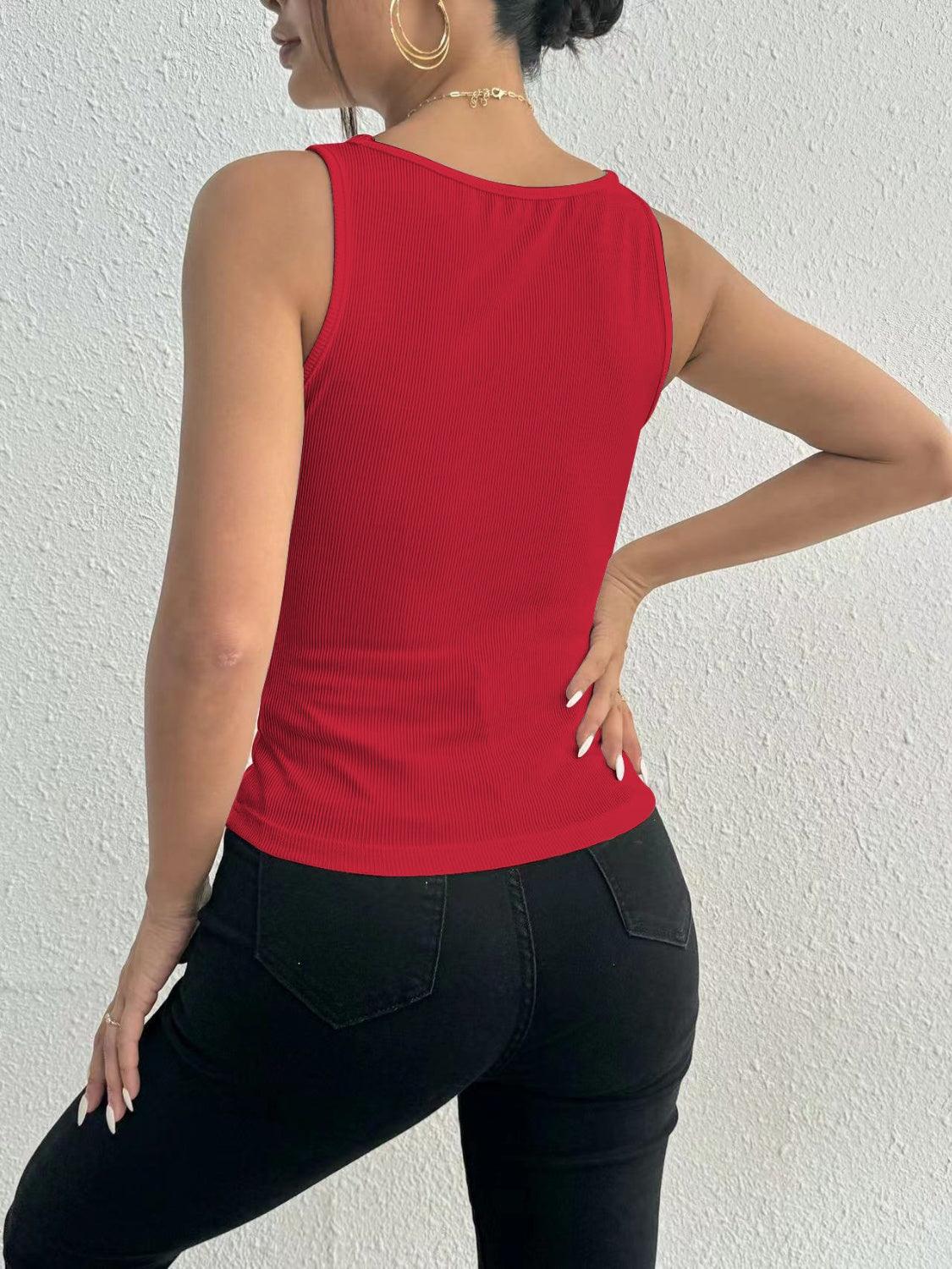a woman in black pants and a red top
