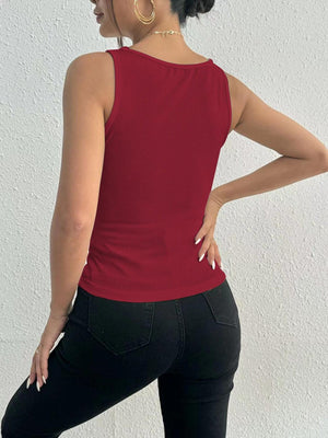 a woman in black pants and a red top