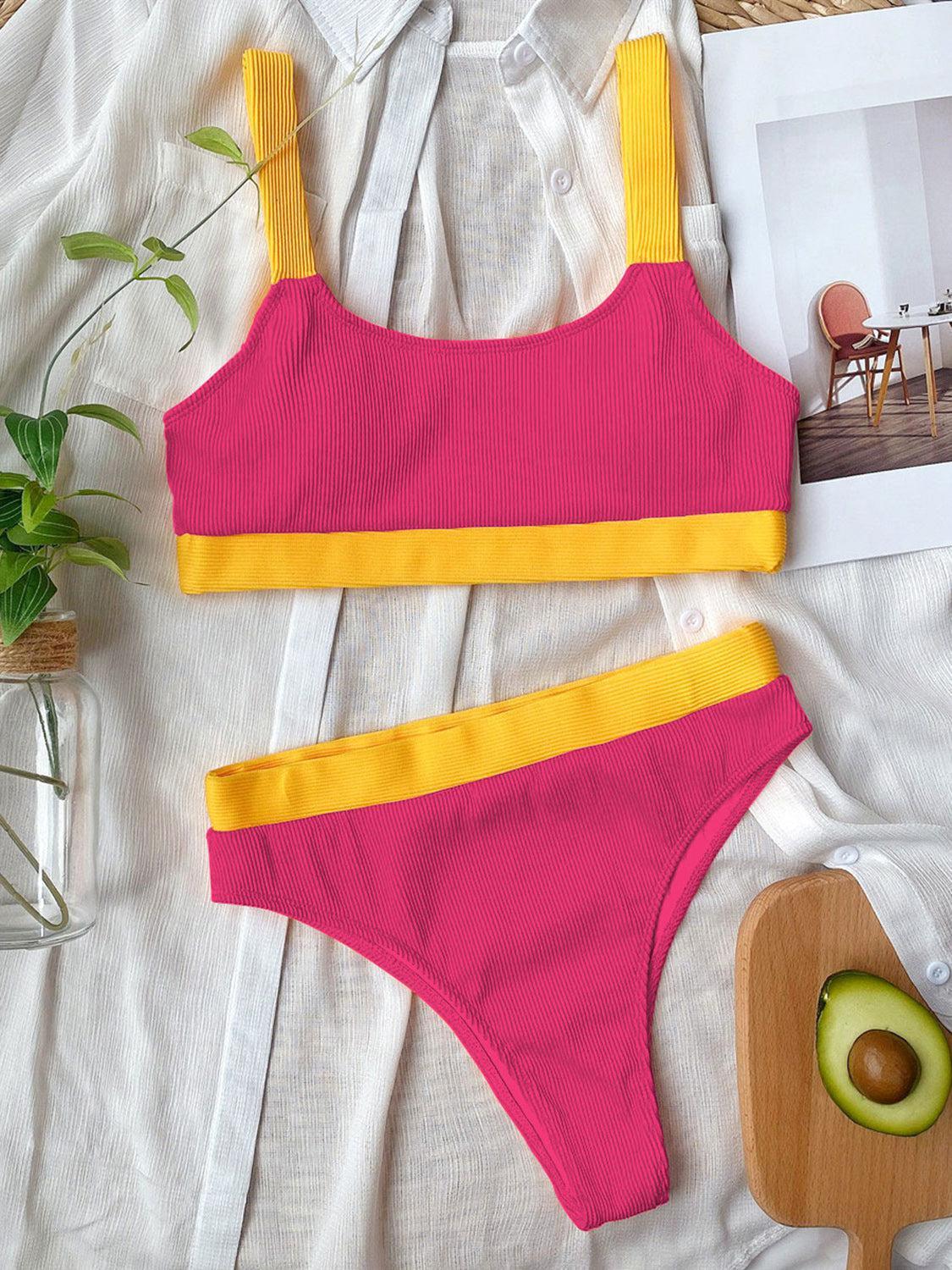 a pink and yellow two piece swimsuit next to an avocado