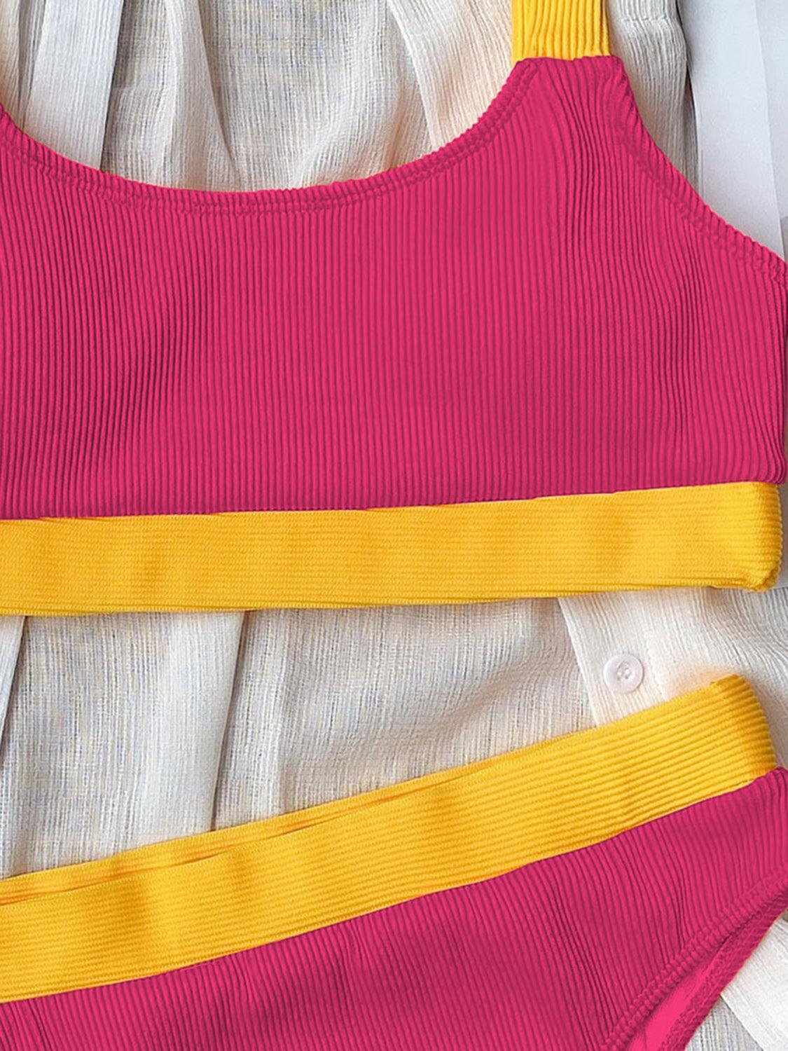 a close up of a pink and yellow top