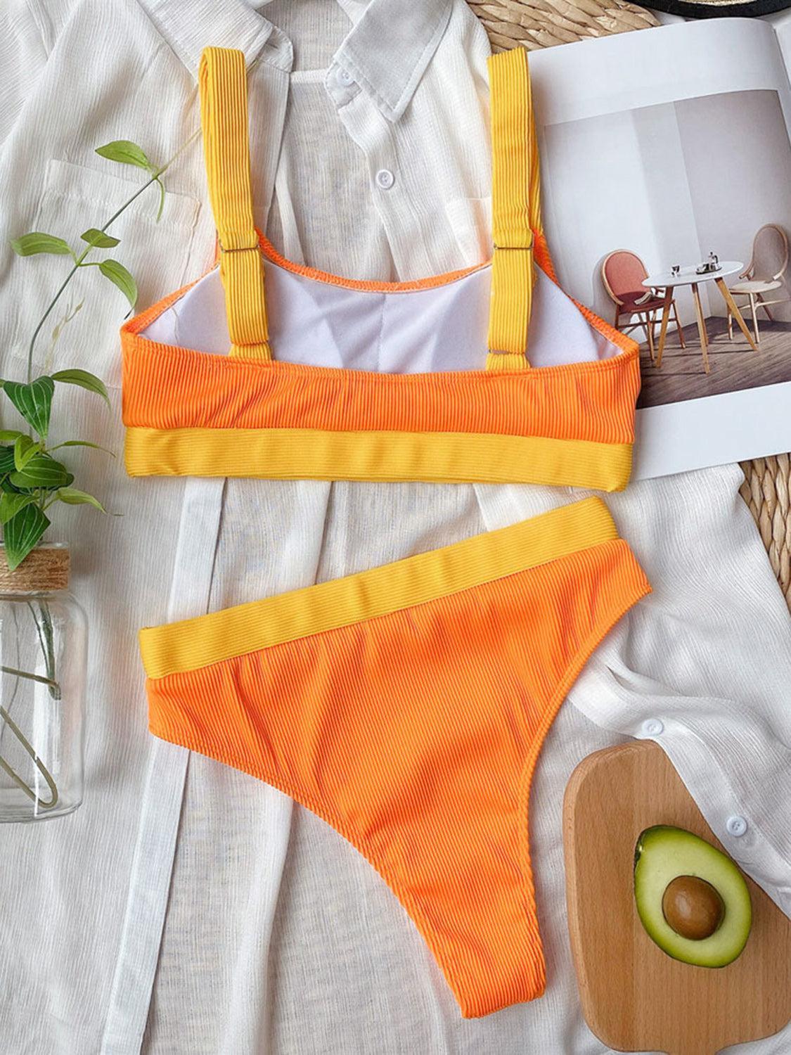 a woman's orange and yellow bikinisuit with an avocado